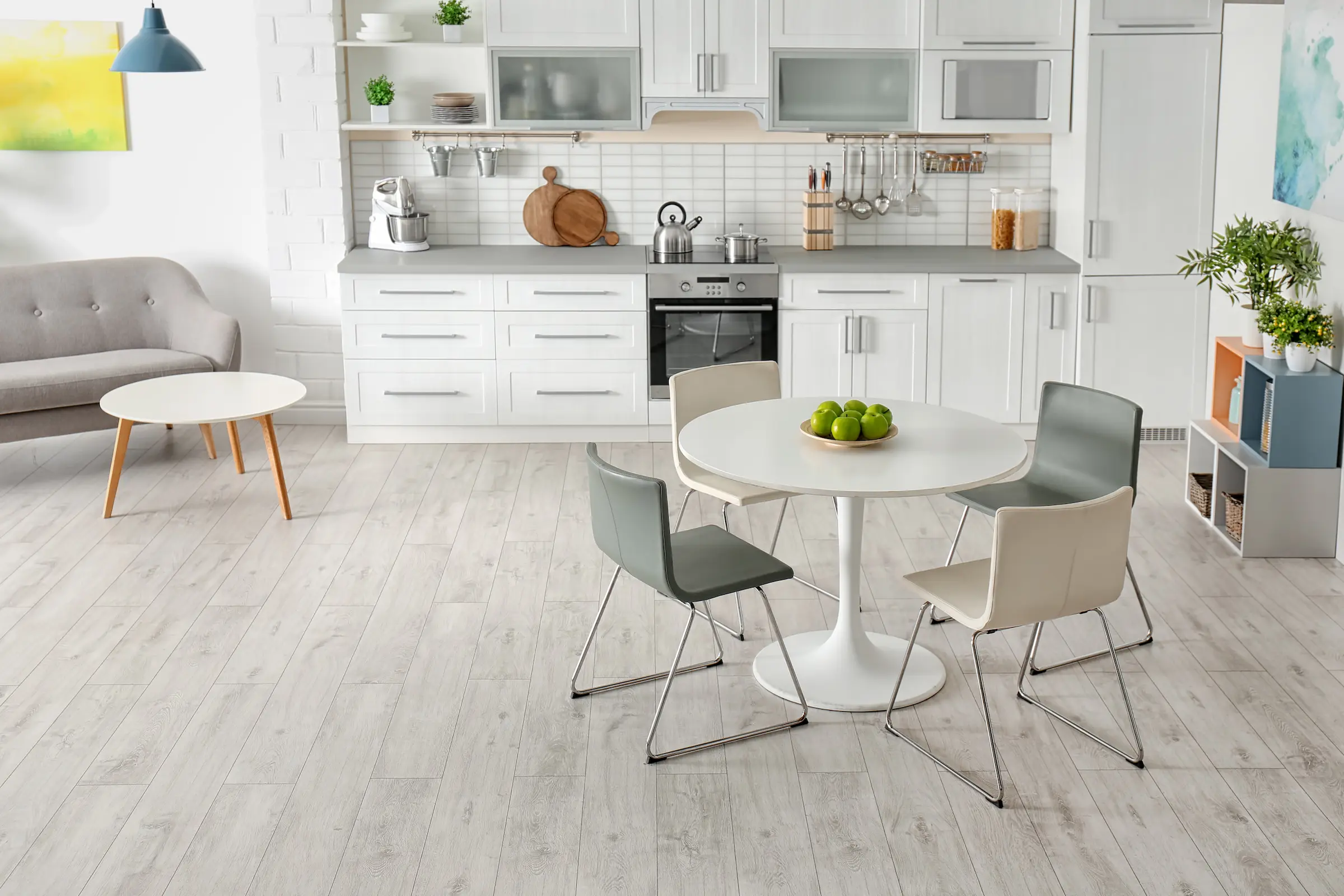 Contemporary kitchen with dining table and green