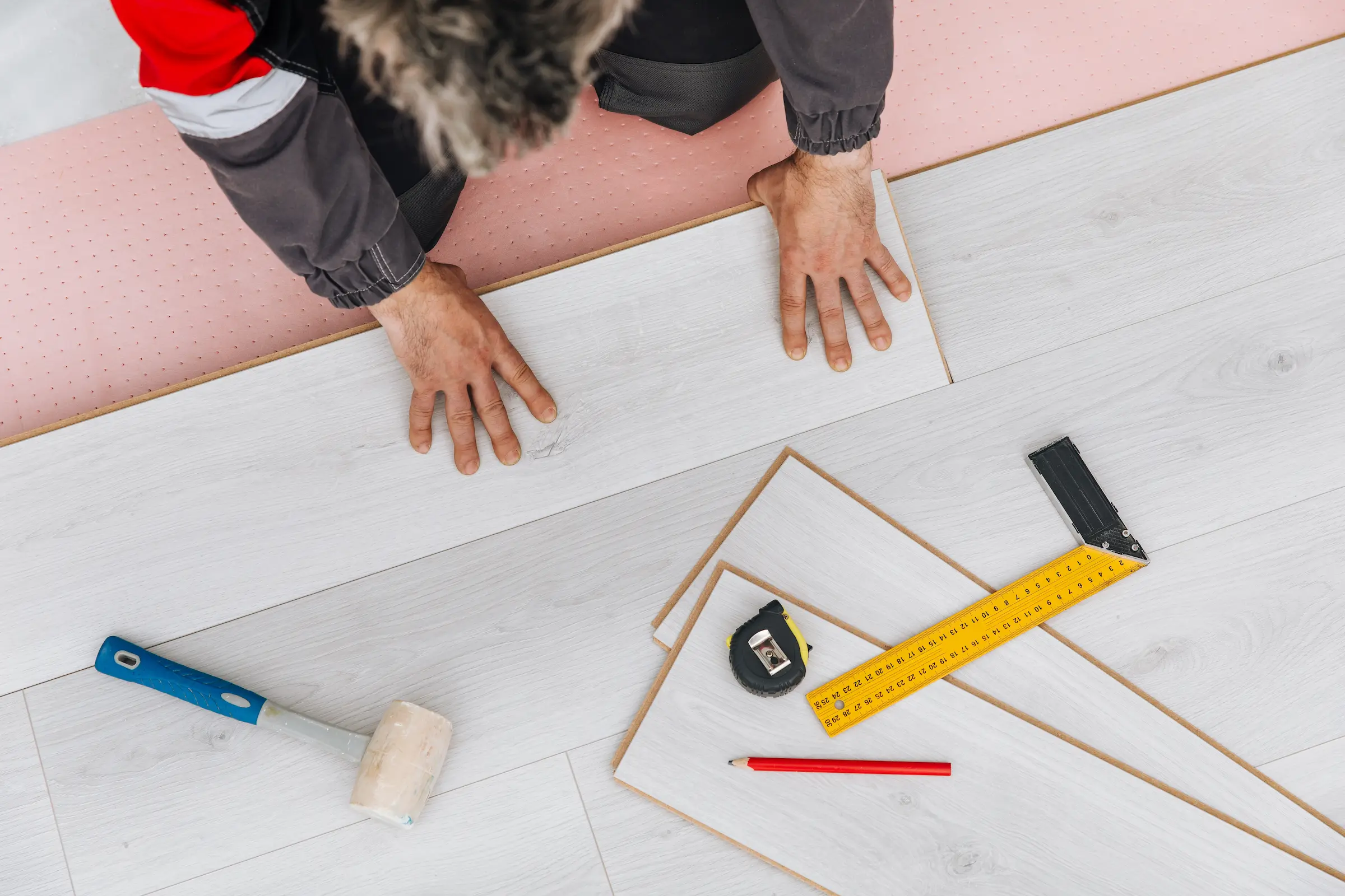 Detailed view of a skilled craftsman installing wo